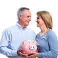 old couple holding a piggybank