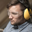 working man wearing safety glasses
