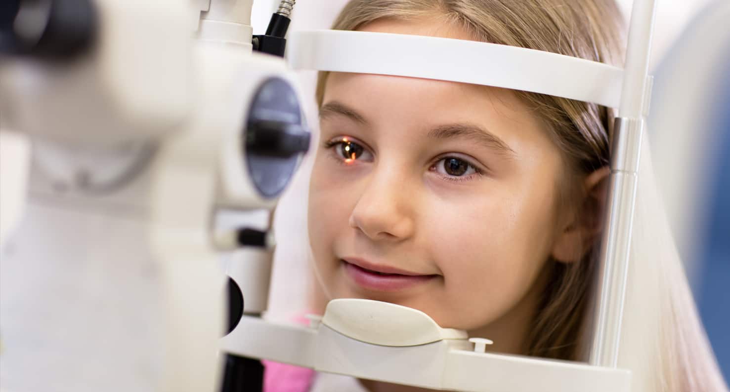 young girl getting an eye exam