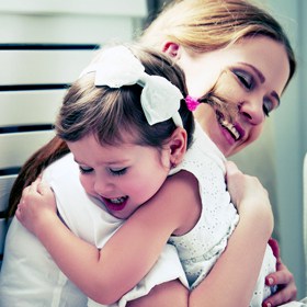 mom hugging child