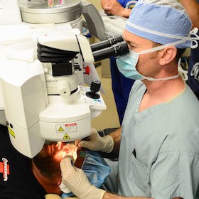 surgeon performing kamra inlay procedure