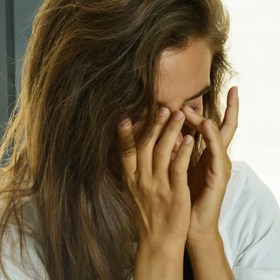woman suffering with a contact len-related infection
