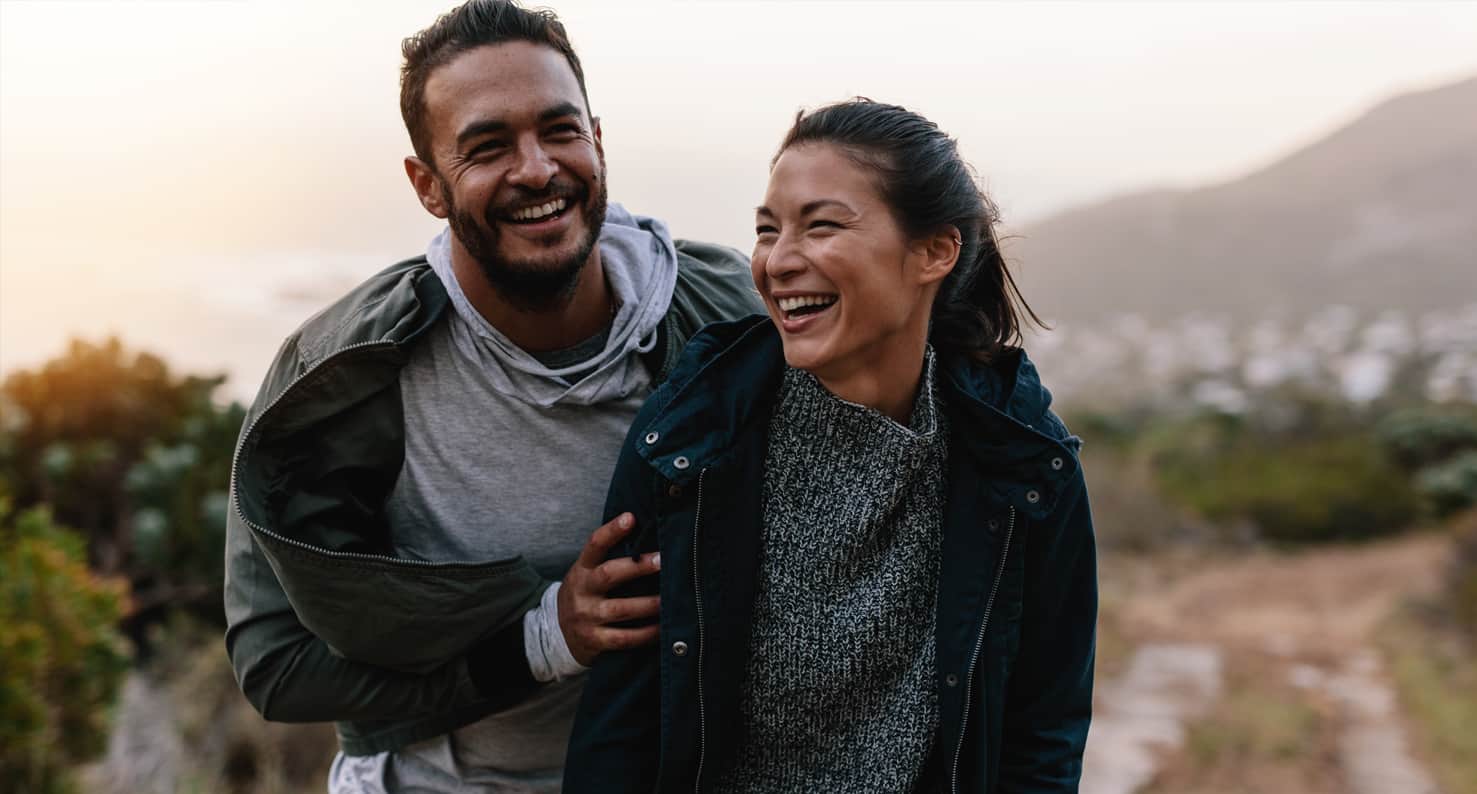 young couple walking outside