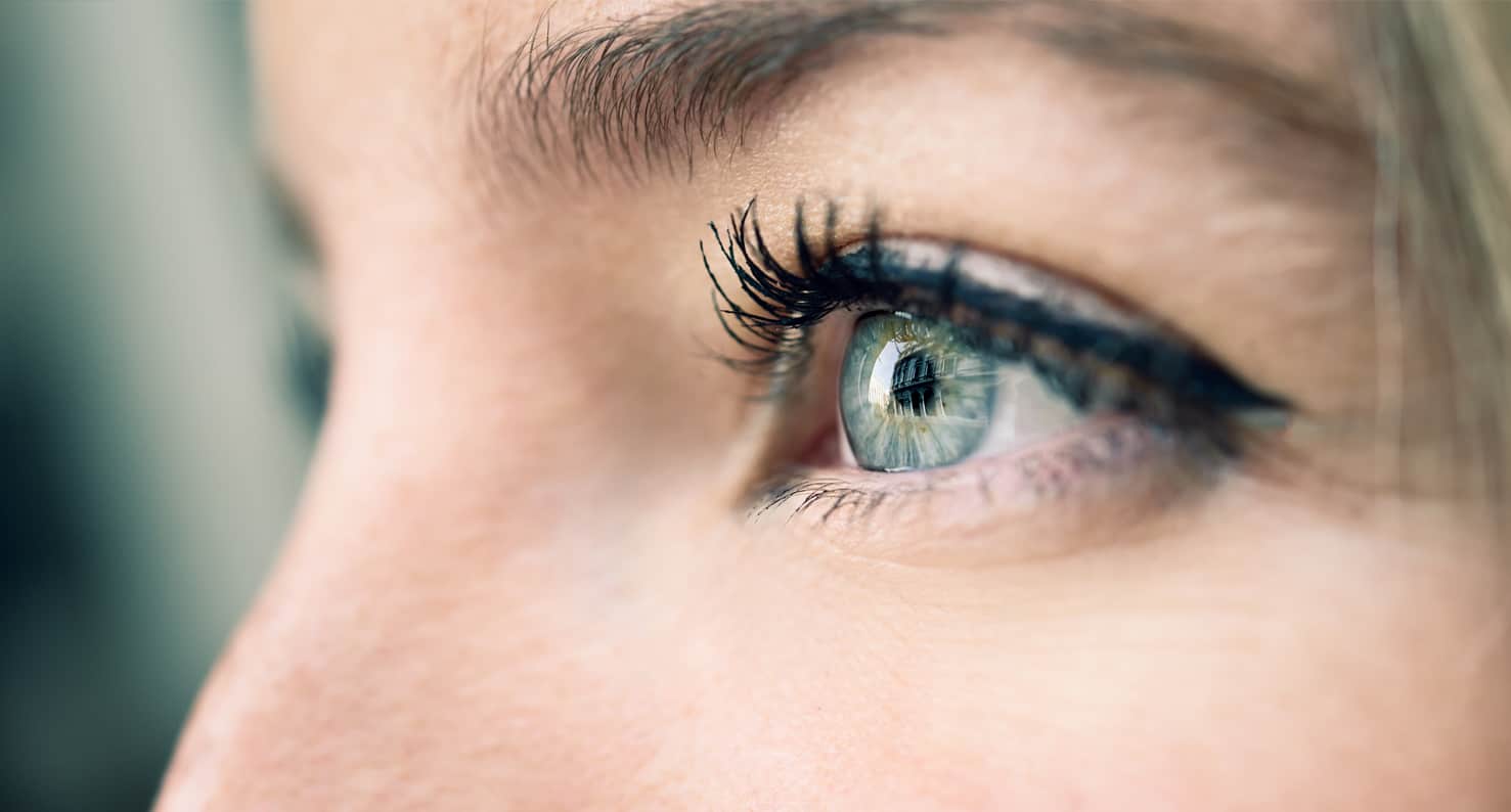 close up of woman's blue eye