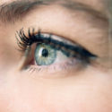 close up of woman's green eye