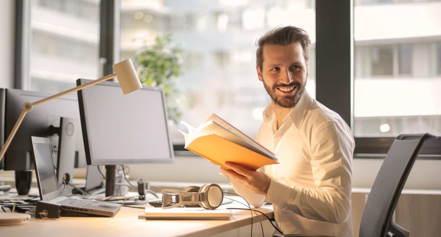 young adult man at work desk