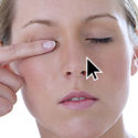 Woman rubbing dry eyes