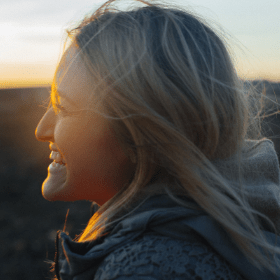 Woman smiling at the sunset