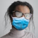 woman wearing a mask with foggy glasses