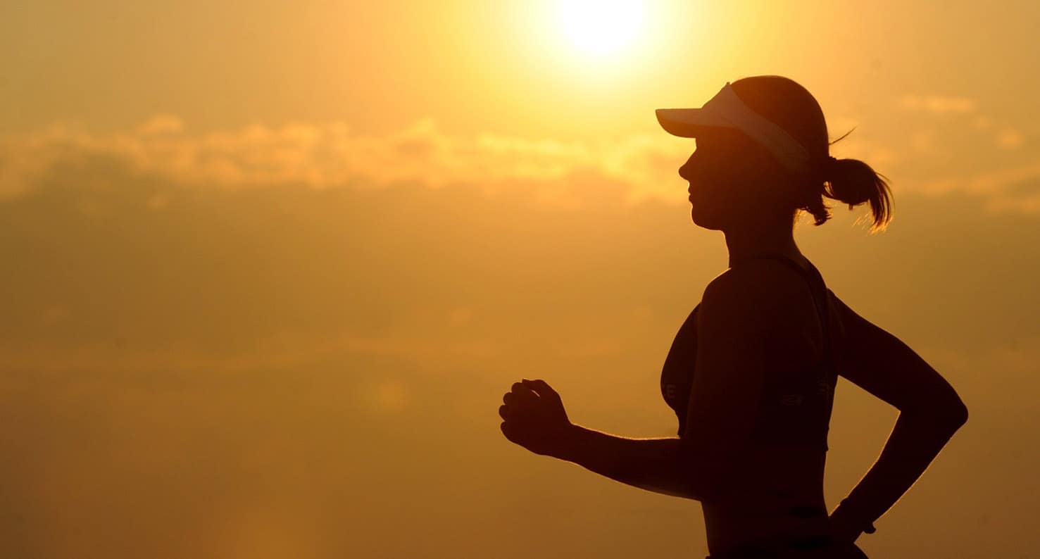 woman running at sunset