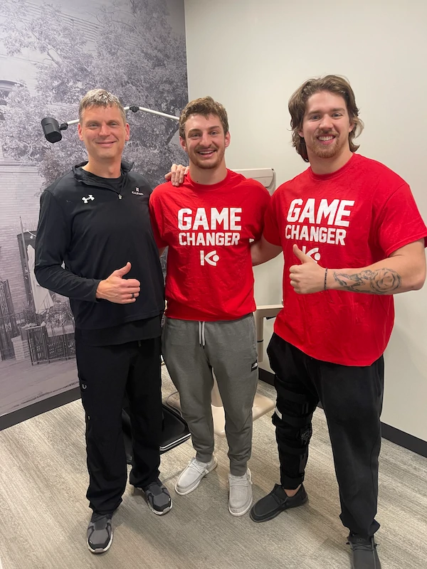 LASIK for Football Players: Dr. Lance Kugler, refractive surgeon, with Husker football players Luke Reimer and Nick Henrich following their successful LASIK procedures.