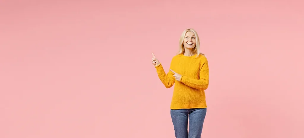 woman pointing up, light adjustable lens in Omaha